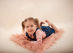 Toddler sits for in studio photo shoot in Pasadena, California with valentine day session